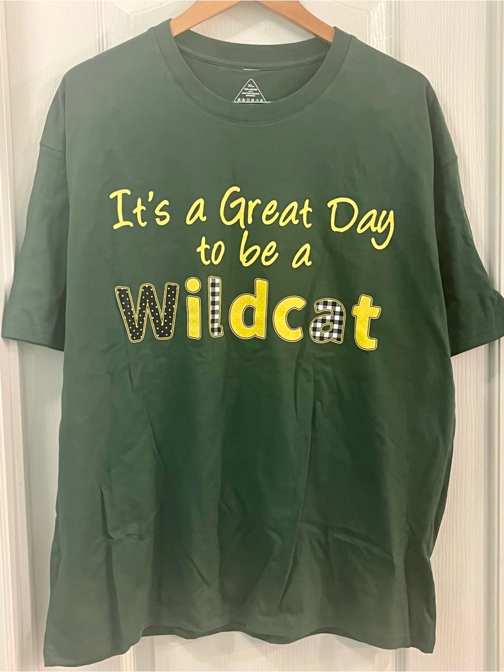 “It's a Great Day to be a Wildcat" XL Tee. Green, yellow, black & white plaid.